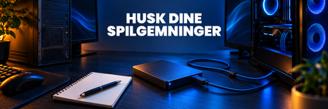 Eksternt drev mellem to computere på et ryddeligt bord med blå belysning.
