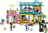 LEGO Friends 42674 – tegneserie- og spilbutikken med fire minidukker og tilbehør