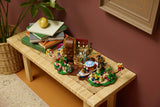 LEGO Ideas 21360 – Willy Wonka og chokoladefabrikken – fabrikken udstillet på en bænk